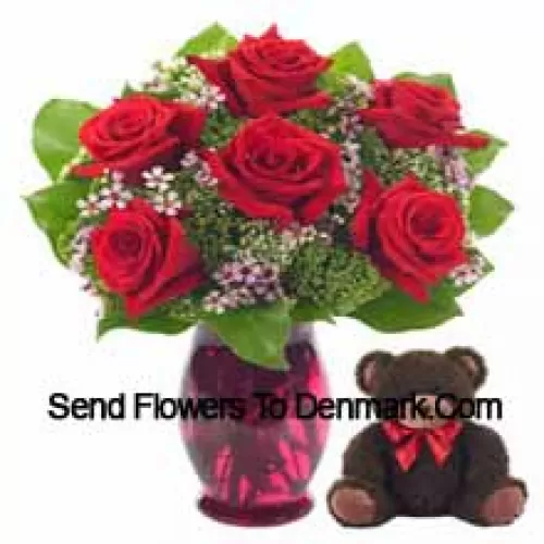 7 Red Roses With Some Ferns In A Glass Vase Along With A Cute 14 Inches Tall Teddy Bear