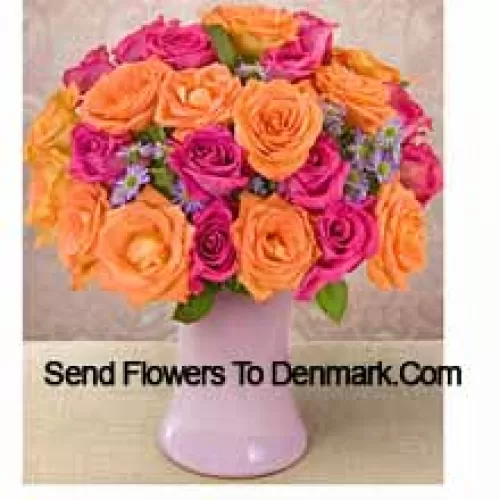 15 Pink And 10 Orange Roses With Seasonal Fillers In A Glass Vase