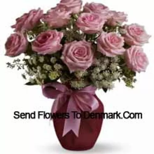 11 Pink Roses With Assorted White Fillers In A Glass Vase