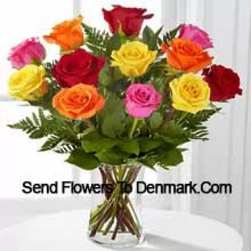 11 Mixed Colored Roses With Some Ferns in A Vase