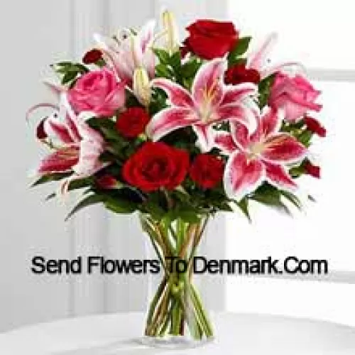 Red And Pink Roses With Pink Lilies And Seasonal Fillers In A Glass Vase