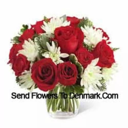 This Bouquet is a charming display of holiday beauty and winter warmth. Rich red roses and spray roses pop against white chrysanthemums, assorted Christmas greens and eucalyptus, arranged in a round clear glass vase to create a gift that will spread the goodwill of the season to your special recipient. (Please Note That We Reserve The Right To Substitute Any Product With A Suitable Product Of Equal Value In Case Of Non-Availability Of A Certain Product)
